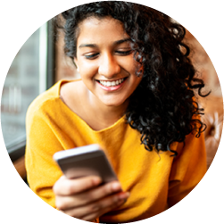 Women looking at cell phone smiling