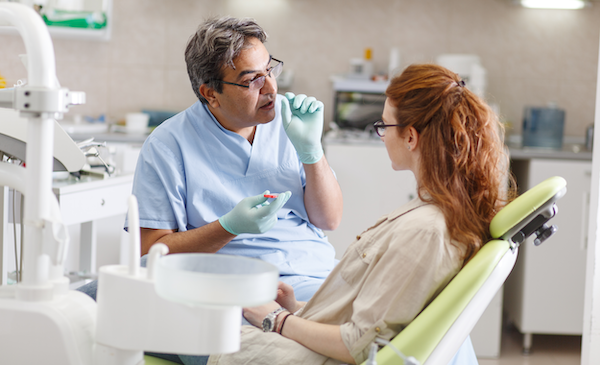mail dentist with woman patient